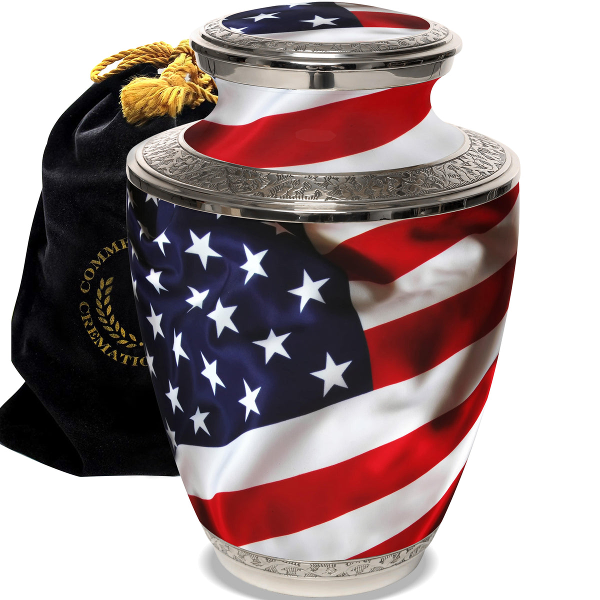 A silver cremation urn with a hand-crafted engraving of the American flag, accompanied by a velvet gift bag.